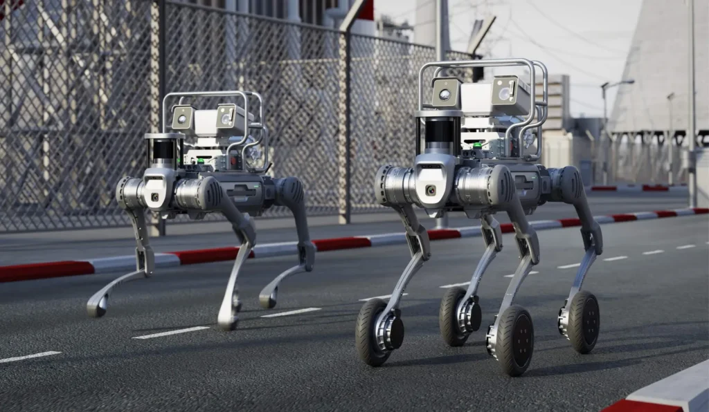 Robots Unitree B2 à pattes et B2-W à roues côte à côte sur un site industriel